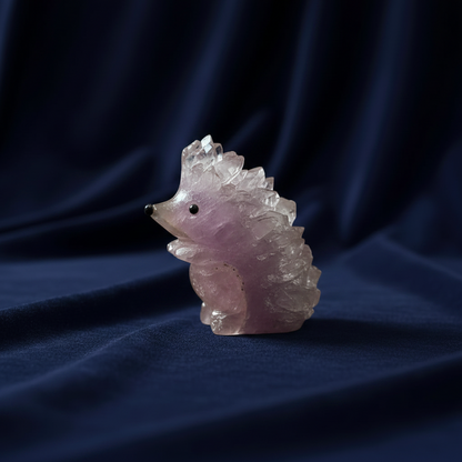 Unique hedgehog-inspired crystal carving with natural amethyst points.